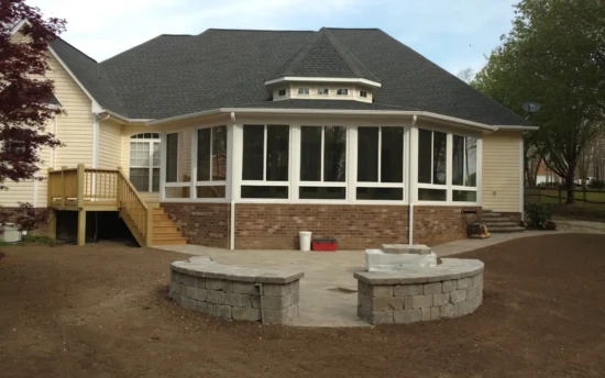 Heated and Cooled Five Side Sunroom Insulated Slider Windows with Screen over Fixed Windows Pavestone Patio With Firepit and Seating Mitsubishi Split Unit Heat Pump with Ceiling Vent (Indian Trail)