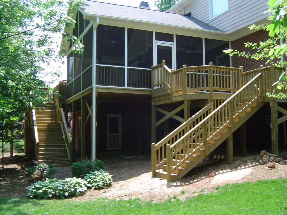 The finished porch, landing and stairs in their wooded setting.