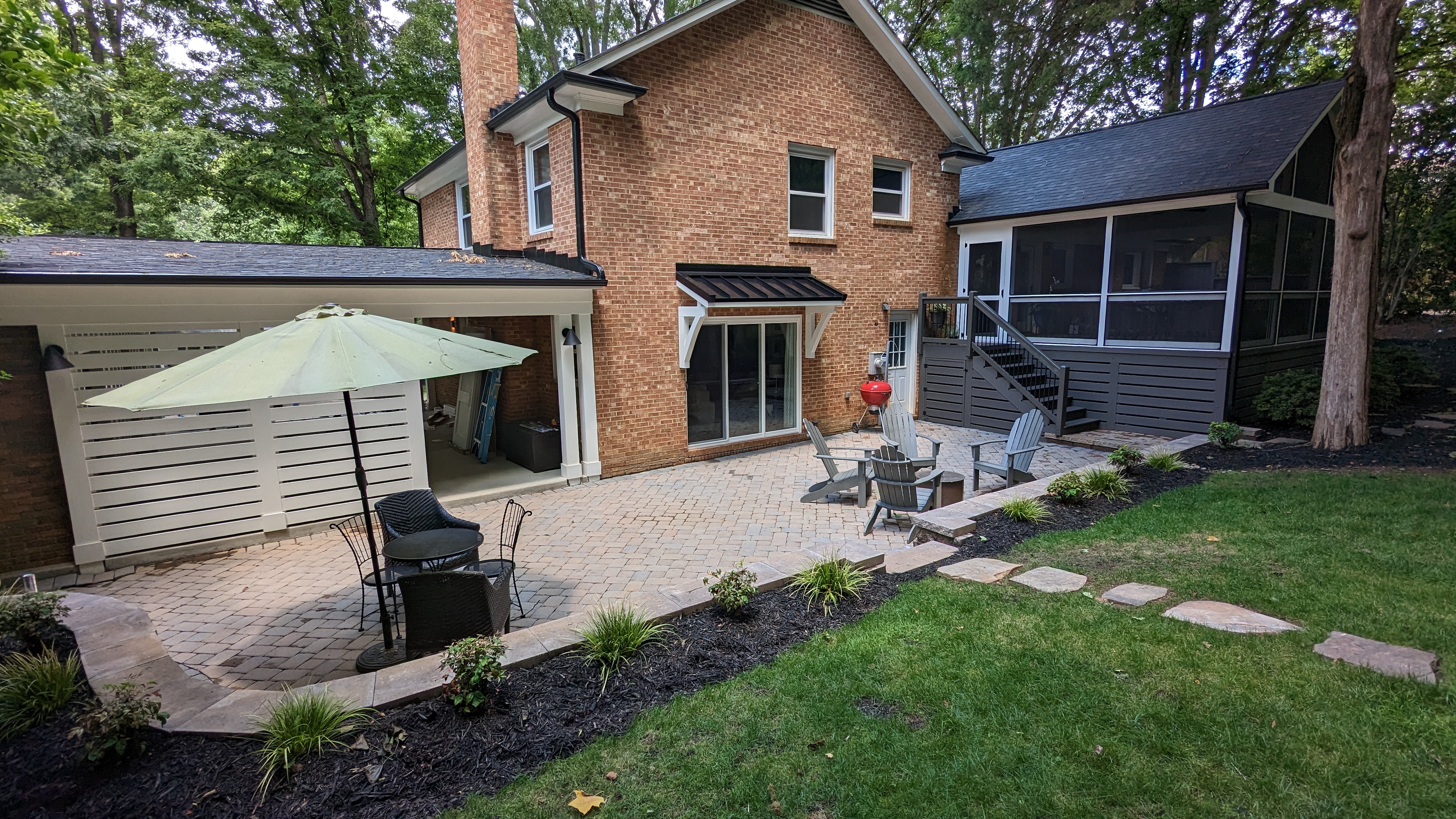 Porch, patio, sliding door and carport connect across the rear of the split-level home.