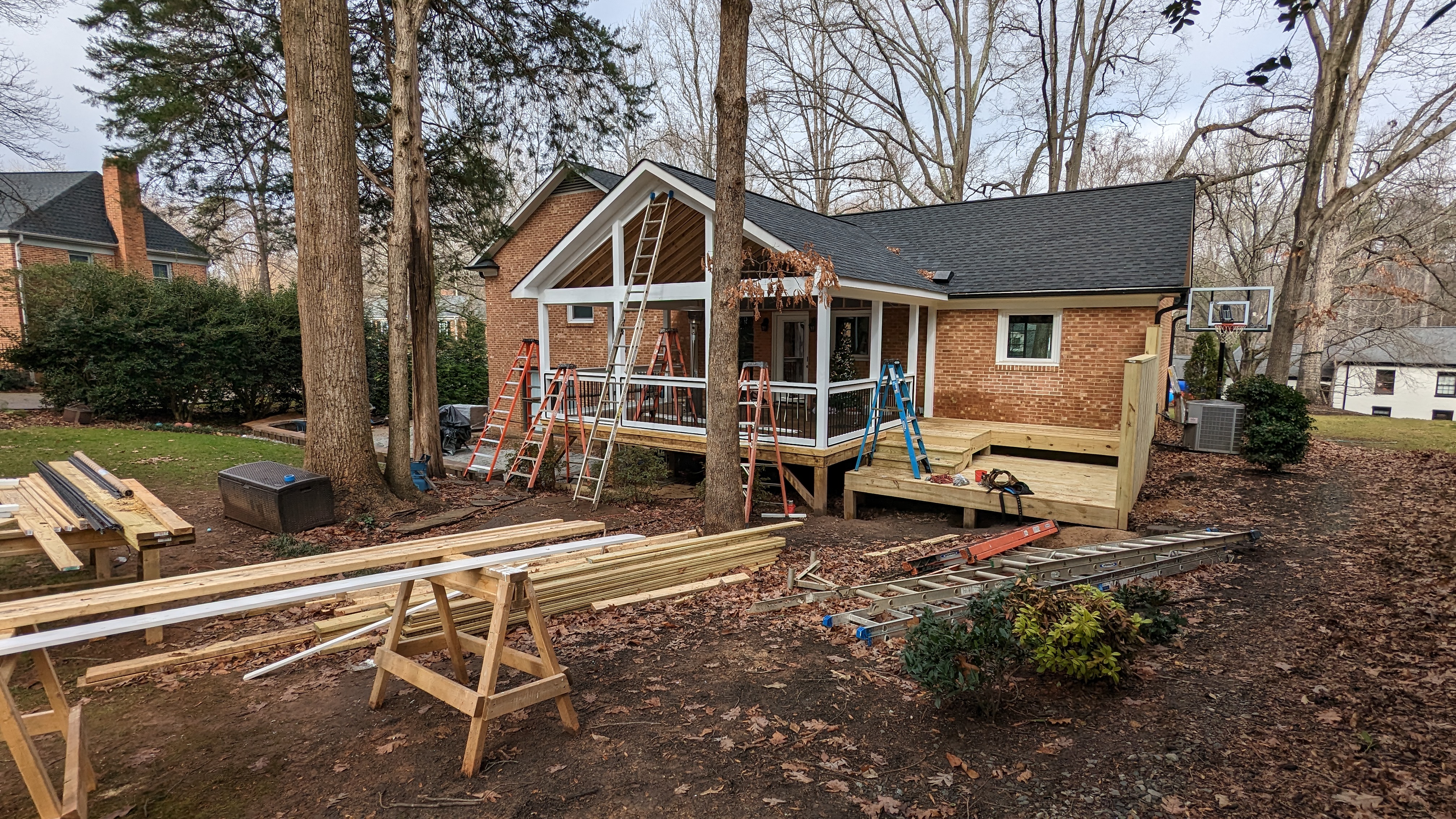 Porch roof, trim and rail framing begin to tie the new space together.