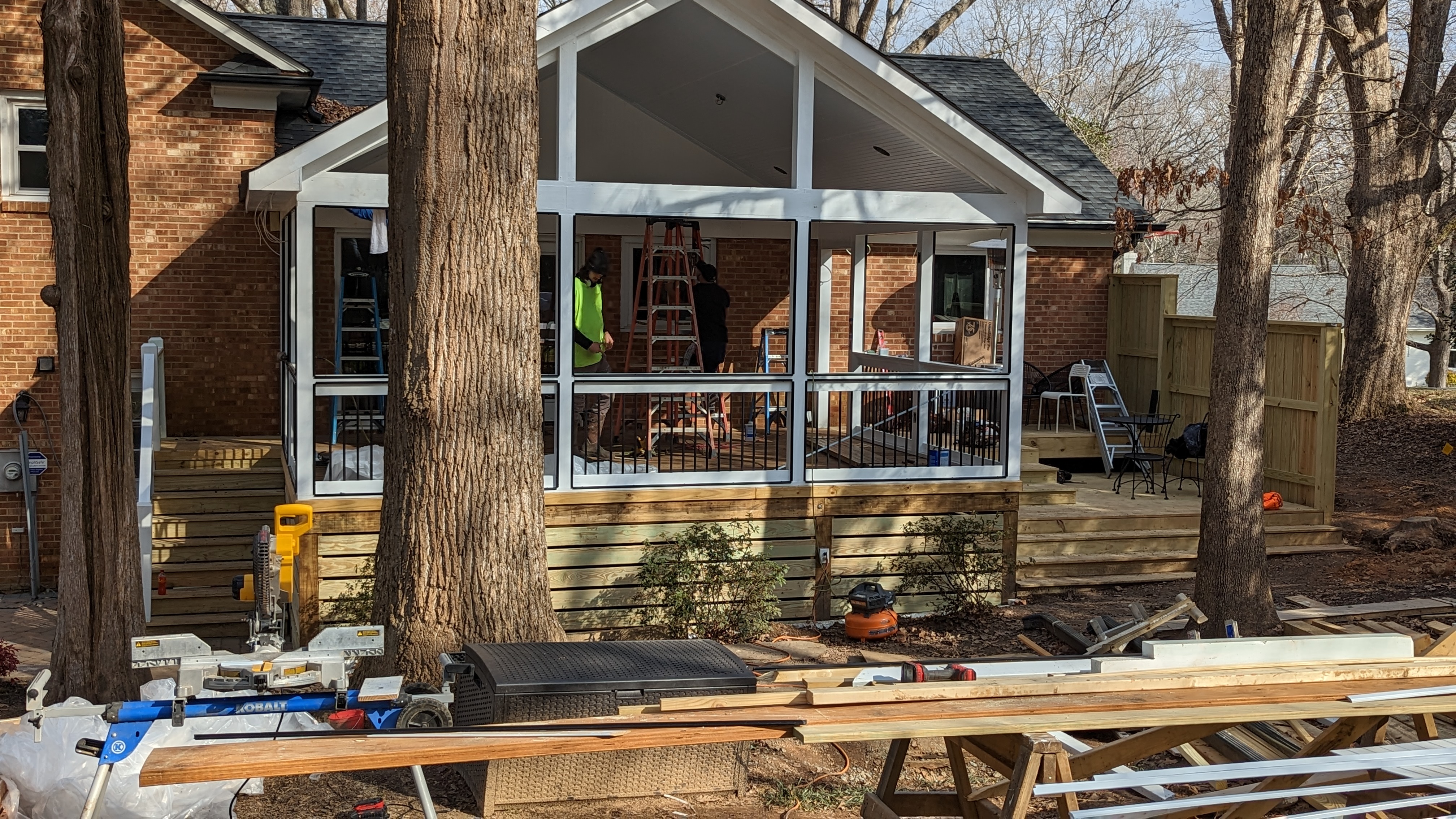 Exterior trim and horizontal skirting give the porch its finished lines.