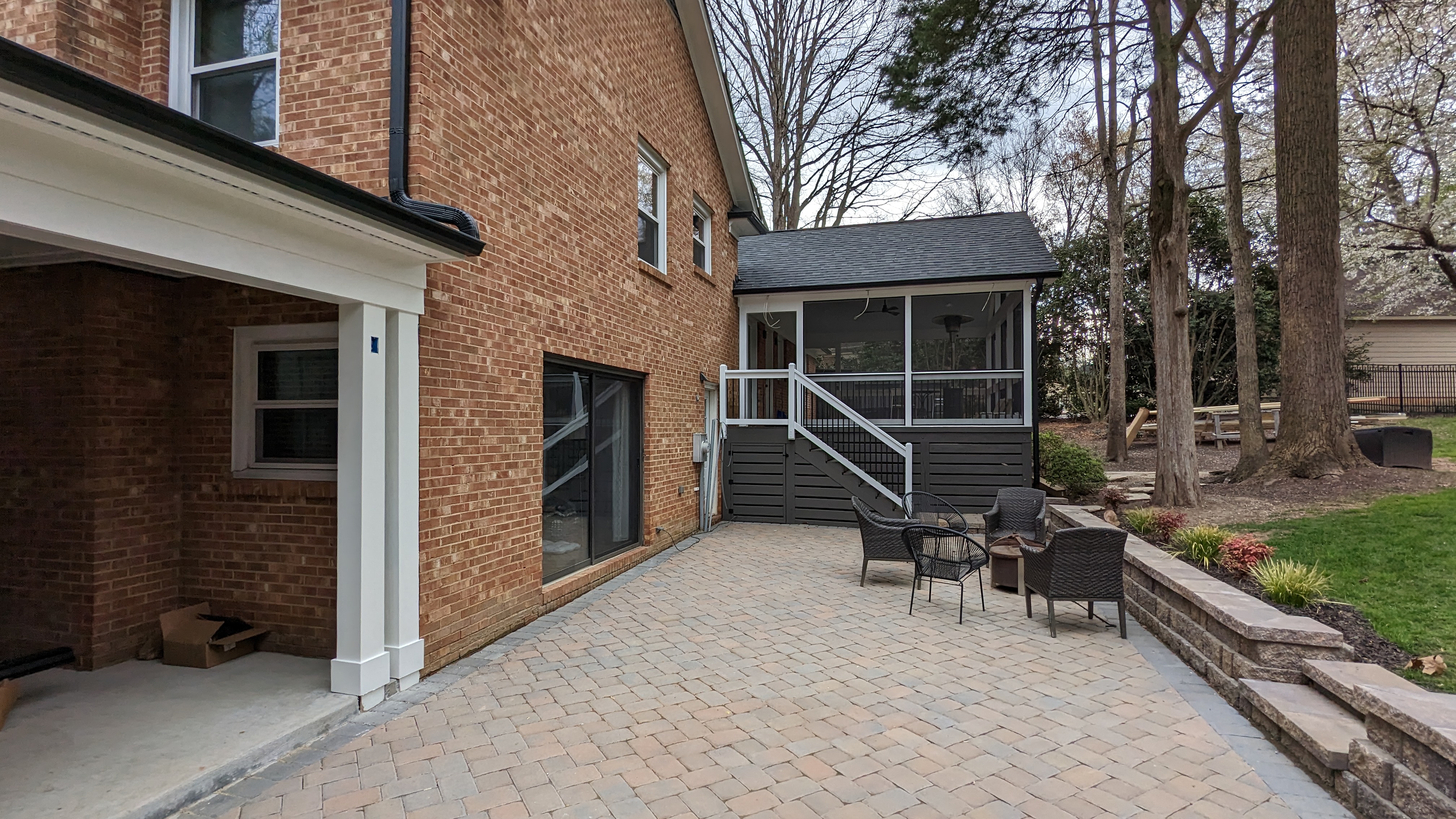 Patio, retaining wall and steps connect the new outdoor spaces.